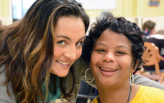 image of Tara with a participant in adult day services